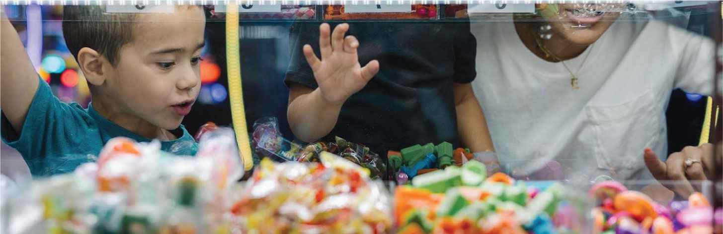 Gallery - Boys playing claw game